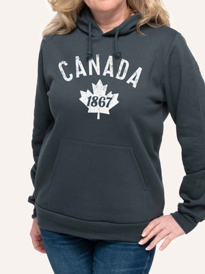 Woman wearing patriotic Grey Hoodie sweatshirt with Canada 1867 and maple leaf - Made in Canada by Choose Canadian Apparel Co