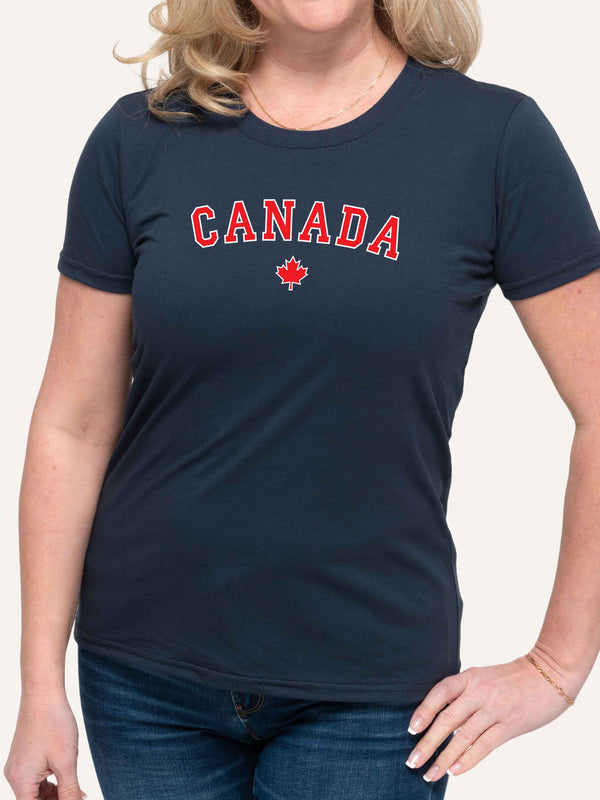 Woman wearing blue t-shirt with canada slogan in block letters and red maple leaf - Made in Canada by Choose Canadian Apparel Co