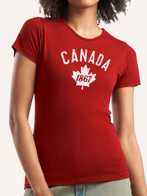 Woman wearing red ladies t-shirt with Canada 1867 graphic and maple leaf - Made in Canada by Choose Canadian Apparel Co