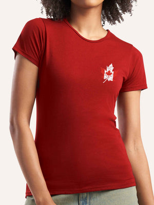Woman wearing ladies red t-shirt with canada flag in shape of maple leaf graphic at left pocket location - Made in Canada by Choose Canadian Apparel Co