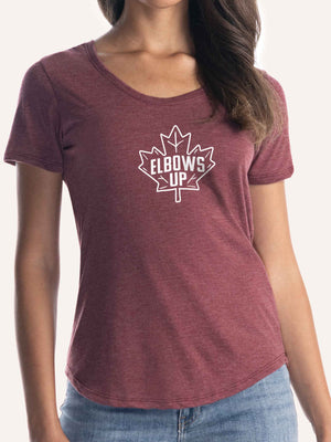Woman wearing ladies burgundy red scoop t-shirt with elbows up in shape of maple leaf graphic - Made in Canada by Choose Canadian Apparel Co