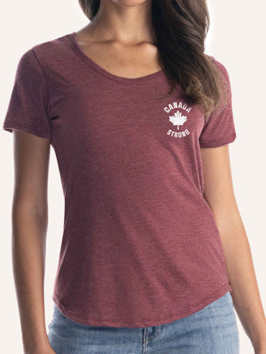 Woman wearing ladies burgundy red t-shirt with maple leaf graphic and canada strong slogan - Made in Canada by Choose Canadian Apparel Co