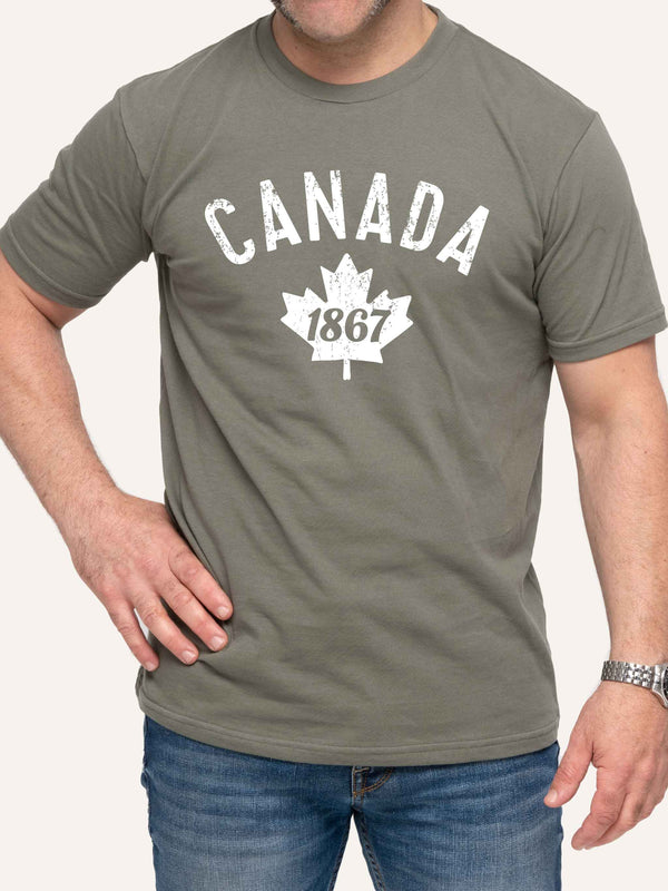 Man wearing sage green tshirt with Canada 1867 and Maple Leaf - Made in Canada by Choose Canadian Apparel Co