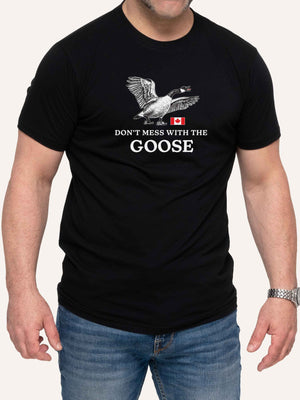 Man wearing black tshirt with Don't Mess With The Goose slogan and Canada Flag - Made in Canada by Choose Canadian Apparel Co