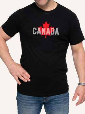 Man wearing black t-shirt with Maple Leaf and vertical white lines - Made in Canada by Choose Canadian Apparel Co