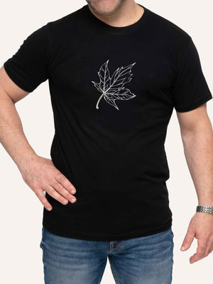 Man wearing black t-shirt with maple leaf line art outline - Made in Canada by Choose Canadian Apparel Co