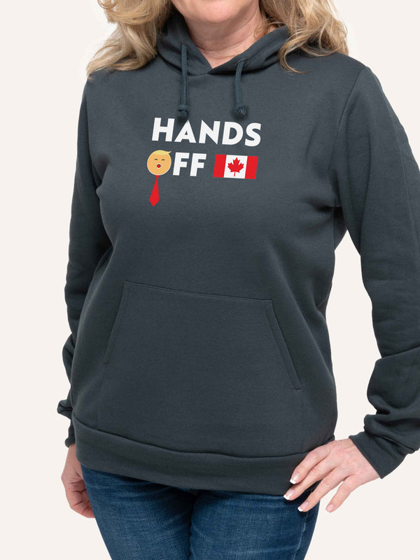 Woman wearing Grey Hooded sweatshirt with Hands Off Trump slogan and Canada Flag - Made in Canada by Choose Canadian Apparel Co