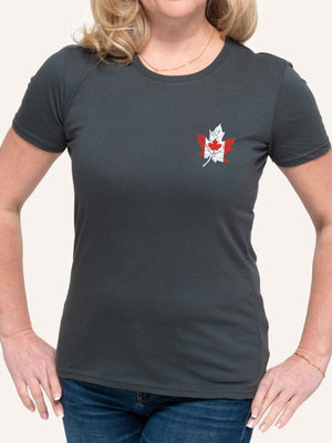 Woman wearing ladies dark grey t-shirt with canada flag in shape of maple leaf graphic at left pocket location - Made in Canada by Choose Canadian Apparel Co