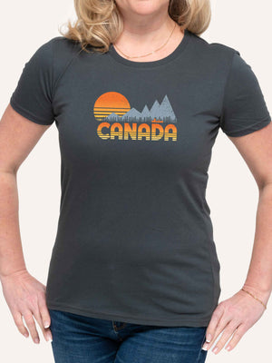Woman wearing grey camping t-shirt with CANADA slogan and orange sunset, mountain, trees and canoe graphic - Made in Canada by Choose Canadian Apparel Co