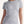 Woman wearing light grey t-shirt with maple leaf outline line art - Made in Canada by Choose Canadian Apparel Co