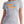 Woman wearing light grey camping t-shirt with CANADA slogan and orange sunset, mountain, trees and canoe graphic - Made in Canada by Choose Canadian Apparel Co