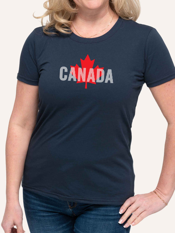 Woman wearing lnavy blue t-shirt with red maple leaf and canada day graphic - Made in Canada by Choose Canadian Apparel Co