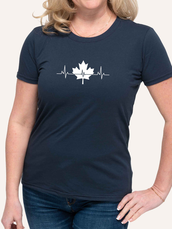 Woman wearing navy blue t-shirt with maple leaf and heartbeat pulse graphic - Made in Canada by Choose Canadian Apparel Co