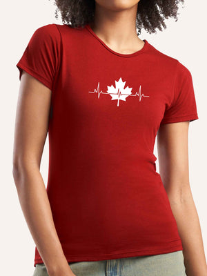 Woman wearing red t-shirt with maple leaf and heartbeat pulse graphic - Made in Canada by Choose Canadian Apparel Co