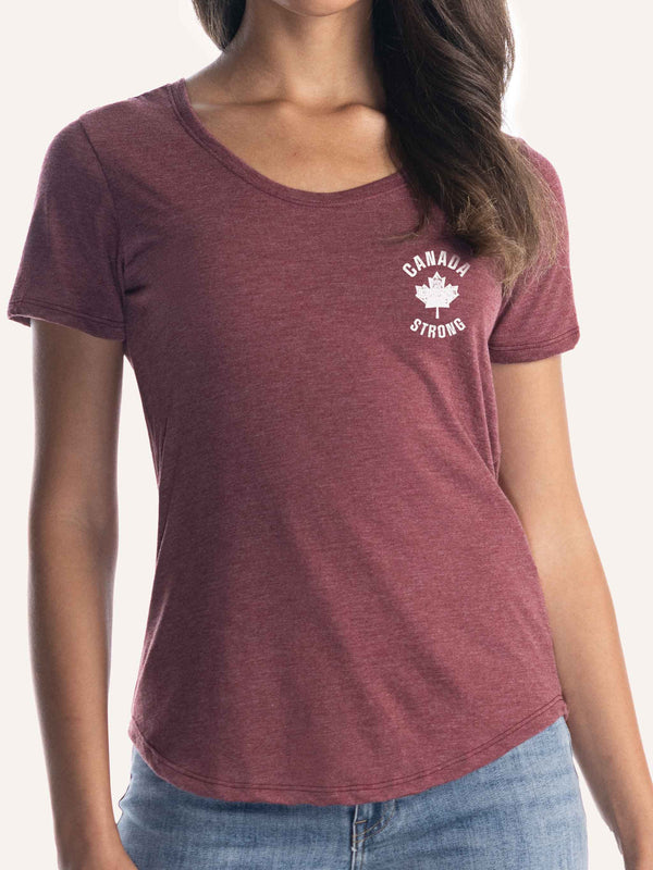 Woman wearing ladies burgundy red t-shirt with maple leaf graphic and canada strong slogan - Made in Canada by Choose Canadian Apparel Co
