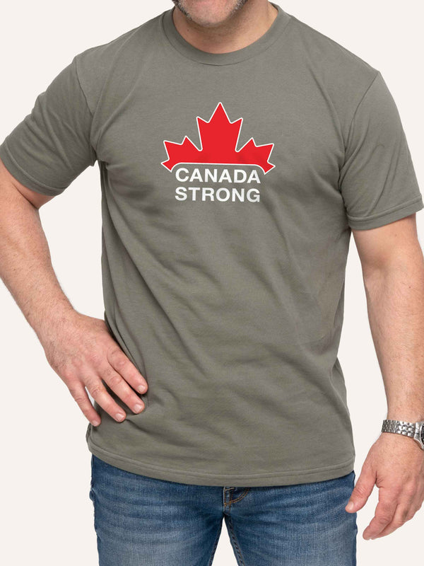 Man wearing sage green unisex t-shirt with Canada Strong slogan and red maple leaf - Made in Canada by Choose Canadian Apparel Co