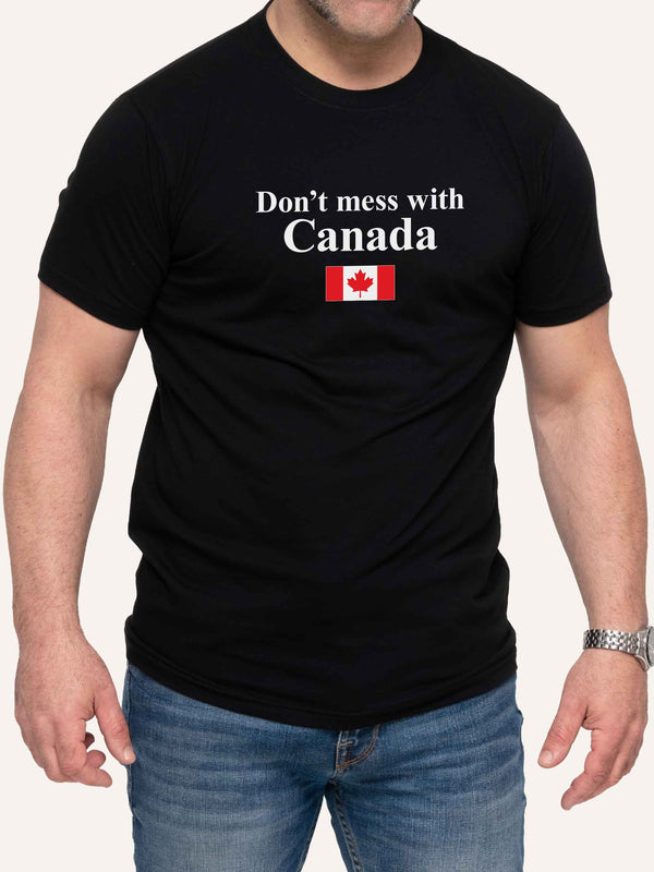 Man wearing black t-shirt with Don't Mess With Canada slogan and canada flag - Made in Canada by Choose Canadian Apparel Co