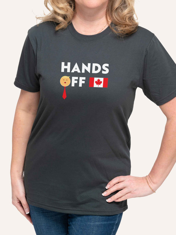 Woman wearing unisex Gray t-shirt with Hands Off slogan and Canada Flag and Trump Face - Made in Canada by Choose Canadian Apparel Co