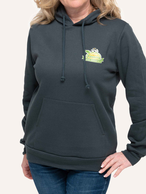 Woman wearing Grey Hooded sweatshirt with tractor image and Canadian Farmers Grow Communities slogan - Made in Canada by Choose Canadian Apparel Co