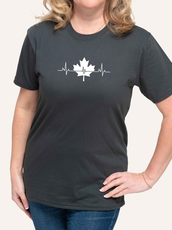 Woman wearing grey t-shirt with maple leaf and pulse heartbeat graphic - Made in Canada by Choose Canadian Apparel Co