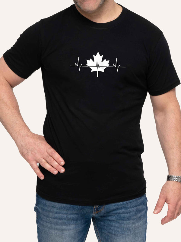 Man wearing black t-shirt with maple leaf and pulse heartbeat graphic - Made in Canada by Choose Canadian Apparel Co