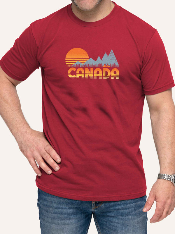 Man wearing red camping t-shirt with Canada, sunset, canoe, and mountains - Made in Canada by Choose Canadian Apparel Co