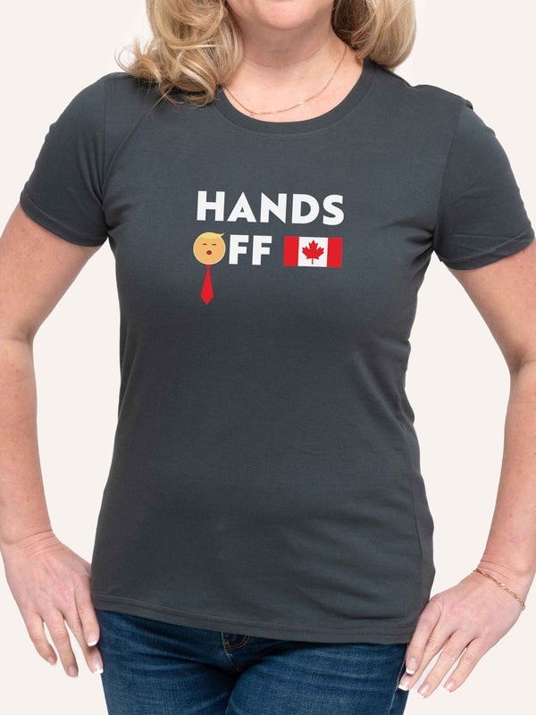 Woman wearing grey tshirt with Trump Hands Off slogan and Canada Flag - Made in Canada by Choose Canadian Apparel Co