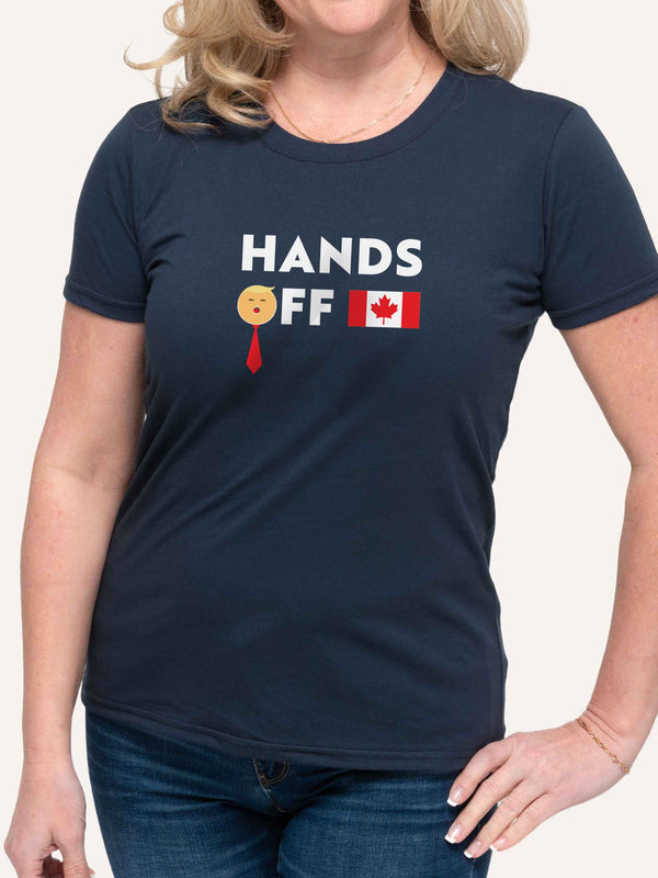 Woman wearing navy blue tshirt with Trump Hands Off slogan and Canada Flag - Made in Canada by Choose Canadian Apparel Co